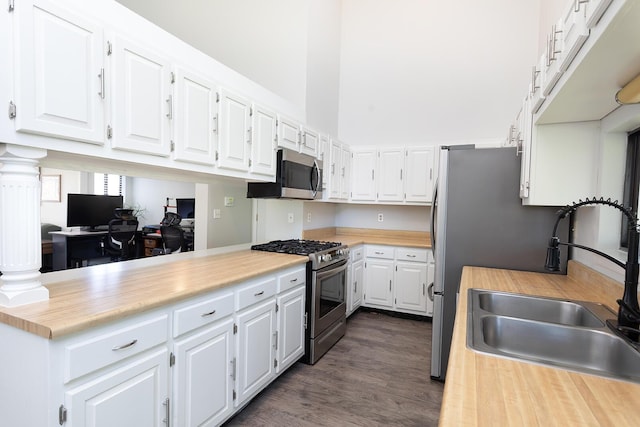 175 Twitty Rd, Dunlap, TN 37327 - kitchen with appliances with stainless steel finishes, a high ceiling, white cabinetry, dark wood-style flooring, and a desk