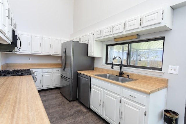 175 Twitty Rd, Dunlap, TN 37327 - kitchen featuring stainless steel appliances, white cabinetry, dark wood-style flooring, and butcher block counters