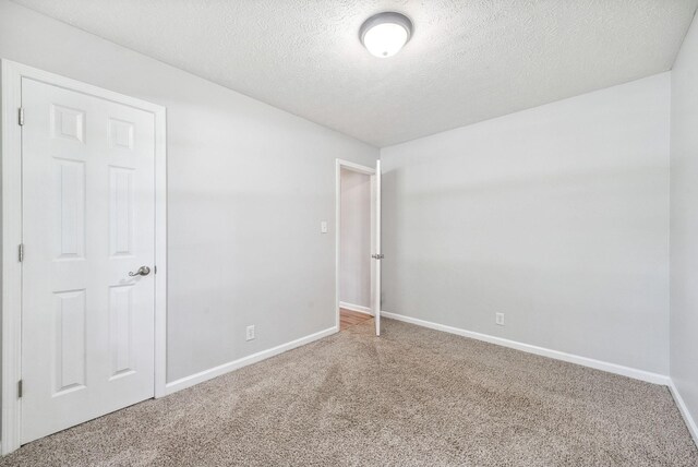 643 Artic Ave, Oak Grove, KY 42262 - carpeted spare room featuring baseboards and a textured ceiling