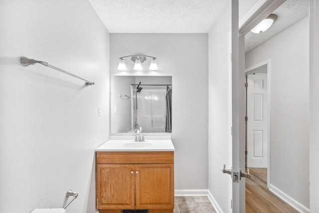 643 Artic Ave, Oak Grove, KY 42262 - full bathroom featuring vanity, a textured ceiling, and a shower