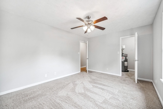 643 Artic Ave, Oak Grove, KY 42262 - unfurnished bedroom featuring electric water heater, carpet floors, a textured ceiling, and ceiling fan