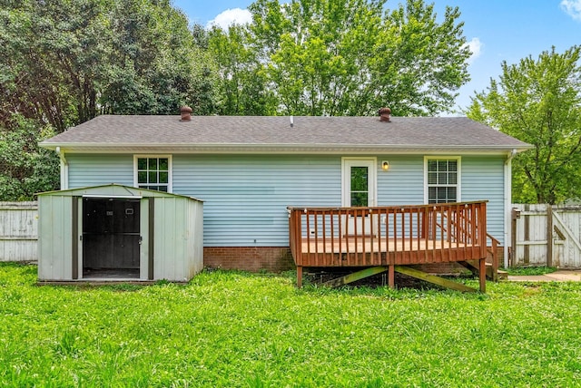 643 Artic Ave, Oak Grove, KY 42262 - back of property featuring a deck, a storage unit, and a shingled roof