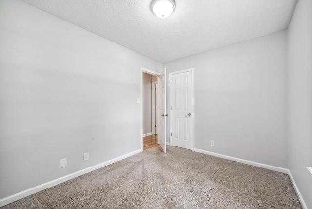 643 Artic Ave, Oak Grove, KY 42262 - empty room with carpet flooring and a textured ceiling