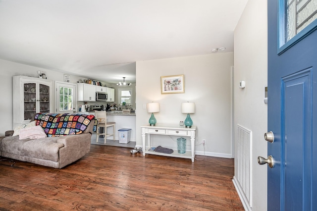 100 Beech St, Columbia, TN 38401 - living room featuring dark wood-style floors and baseboards
