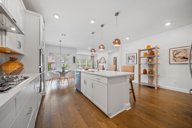 805 Dunbar Ct, Goodlettsville, TN 37072 - kitchen featuring range hood, appliances with stainless steel finishes, dark wood finished floors, recessed lighting, and light countertops