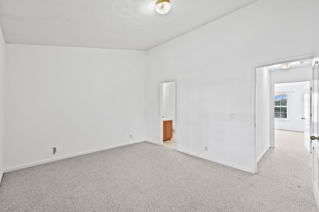 912 Patty Cv, La Vergne, TN 37086 - empty room featuring light colored carpet and a textured ceiling