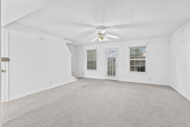 912 Patty Cv, La Vergne, TN 37086 - carpeted empty room with a ceiling fan, a textured ceiling, and stairway