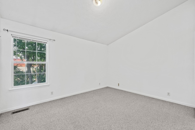 912 Patty Cv, La Vergne, TN 37086 - spare room featuring carpet floors and lofted ceiling