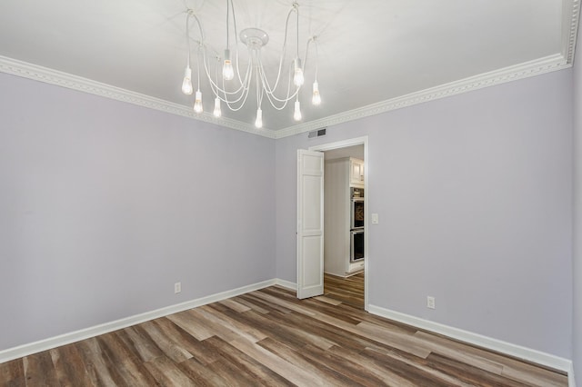3516 Saxon Mist Ct, Nashville, TN 37217 - unfurnished room with a chandelier, wood finished floors, and ornamental molding