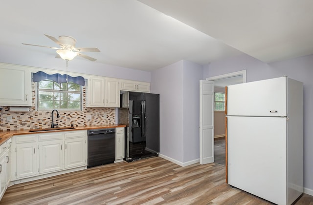 3516 Saxon Mist Ct, Nashville, TN 37217 - kitchen featuring black appliances, wood counters, ceiling fan, tasteful backsplash, and light wood-style floors
