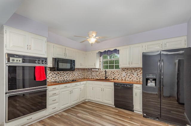 3516 Saxon Mist Ct, Nashville, TN 37217 - kitchen featuring black appliances, ceiling fan, light wood-type flooring, and decorative backsplash