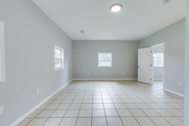 1689 Sumac Rd, Pulaski, TN 38478 - unfurnished room featuring plenty of natural light, a smoke detector, and light tile patterned flooring