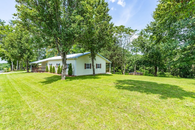 1689 Sumac Rd, Pulaski, TN 38478 - view of green lawn with a wooden deck