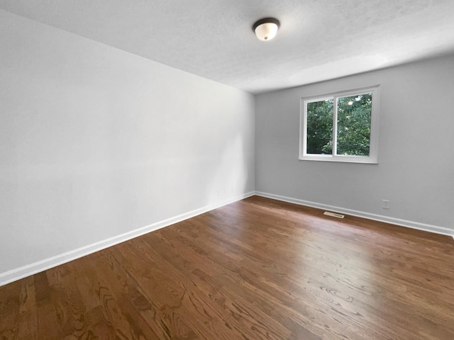 7120 Sutton Pl, Fairview, TN 37062 - spare room with baseboards and dark wood-style floors