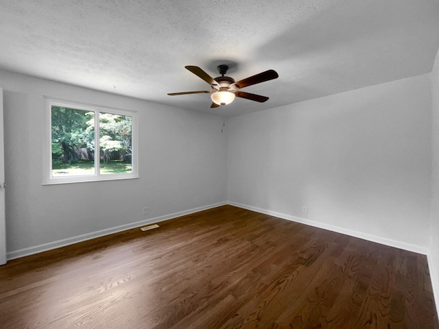 7120 Sutton Pl, Fairview, TN 37062 - spare room featuring a ceiling fan, dark wood-type flooring, and a textured ceiling