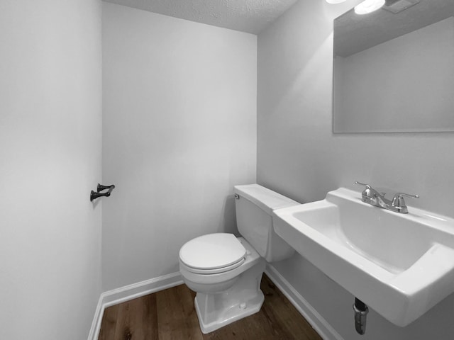 7120 Sutton Pl, Fairview, TN 37062 - bathroom featuring wood finished floors and a textured ceiling