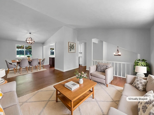 7120 Sutton Pl, Fairview, TN 37062 - living area with a chandelier, vaulted ceiling, and wood finished floors