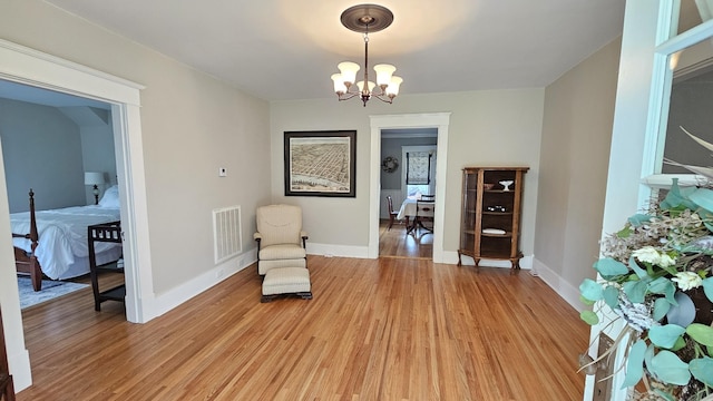 315 Seven Mile Ferry Rd, Cunningham, TN 37052 - living area featuring light wood-style flooring and a chandelier