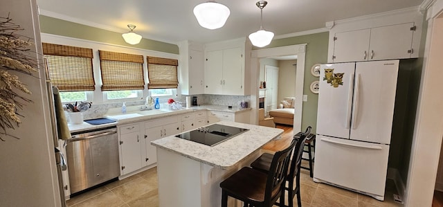 315 Seven Mile Ferry Rd, Cunningham, TN 37052 - kitchen featuring freestanding refrigerator, stainless steel dishwasher, black electric cooktop, light countertops, and a center island
