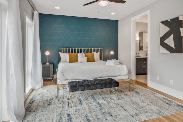 705 27th Ave N, Nashville, TN 37208 - bedroom featuring an accent wall, wood finished floors, ensuite bath, recessed lighting, and ceiling fan