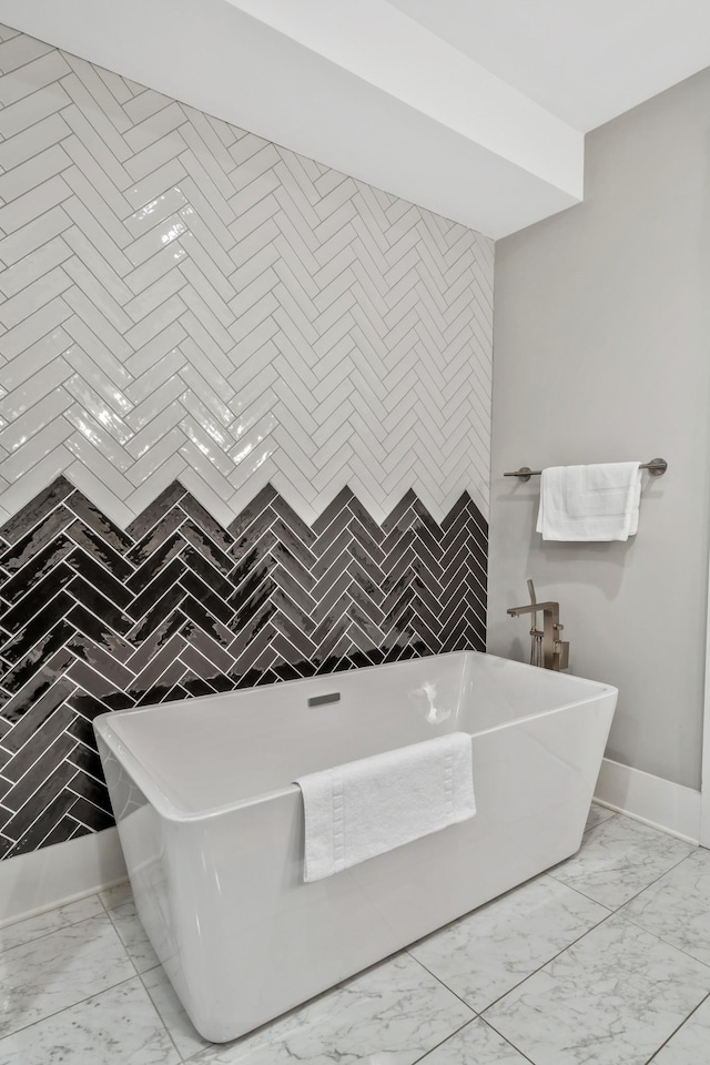 705 27th Ave N, Nashville, TN 37208 - full bathroom featuring marble look tiles and a freestanding tub