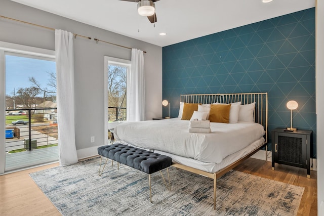 705 27th Ave N, Nashville, TN 37208 - bedroom with an accent wall, access to exterior, wood finished floors, recessed lighting, and a ceiling fan