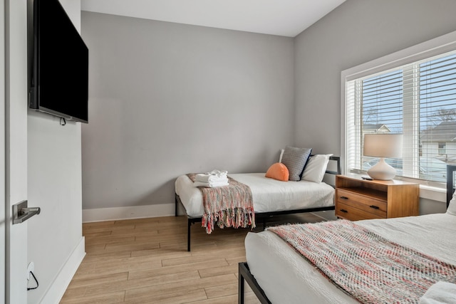 705 27th Ave N, Nashville, TN 37208 - bedroom with multiple windows and light wood-style floors
