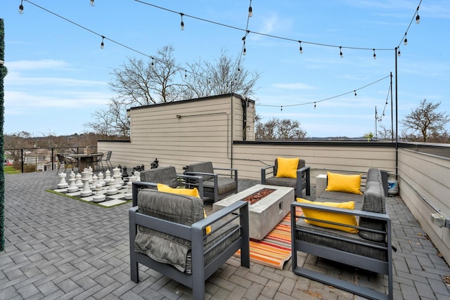 705 27th Ave N, Nashville, TN 37208 - view of patio with an outdoor living space with a fire pit