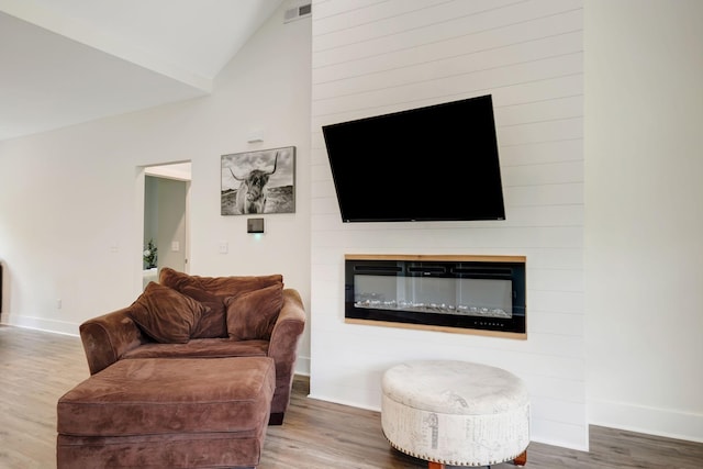 94 Hickory Ridge Ln, Woodbury, TN 37190 - living room with wood finished floors, vaulted ceiling, and a fireplace