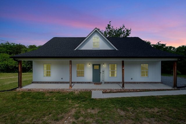 94 Hickory Ridge Ln, Woodbury, TN 37190 - modern farmhouse with a front yard, roof with shingles, and covered porch