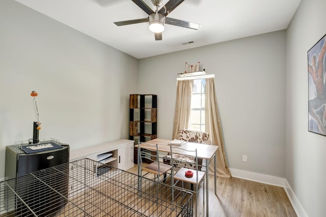 94 Hickory Ridge Ln, Woodbury, TN 37190 - dining area featuring light wood finished floors, a ceiling fan, and a desk