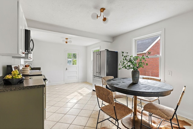 1203 Ardee Ave, Nashville, TN 37216 - dining area with light tile patterned flooring and a textured ceiling
