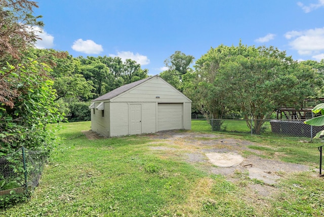 1203 Ardee Ave, Nashville, TN 37216 - view of yard with a detached garage, dirt driveway, and an outbuilding