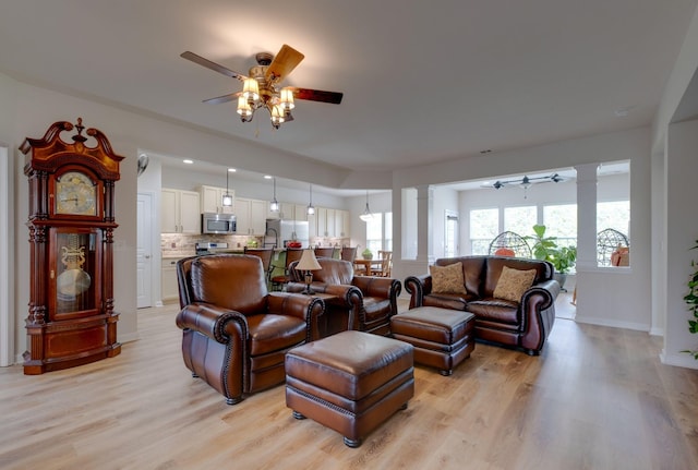 309 Patriotic Way, Mount Juliet, TN 37122 - living room featuring a ceiling fan, ornate columns, and light wood-style flooring