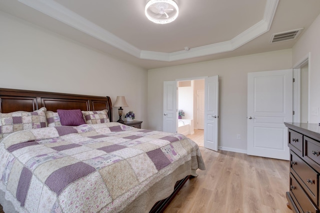 309 Patriotic Way, Mount Juliet, TN 37122 - bedroom with a raised ceiling, light wood-type flooring, and crown molding