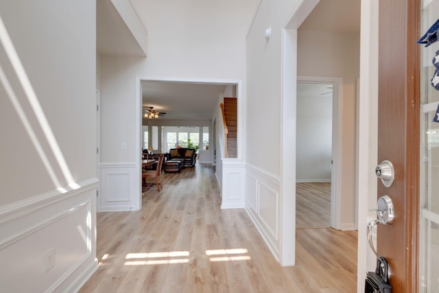 309 Patriotic Way, Mount Juliet, TN 37122 - entryway with light wood-style floors, a decorative wall, wainscoting, and a ceiling fan