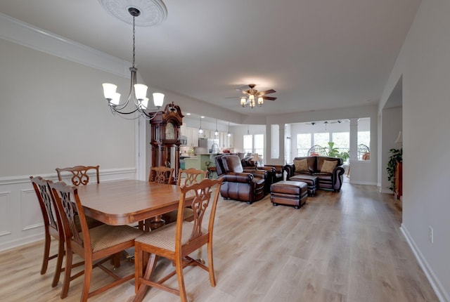 309 Patriotic Way, Mount Juliet, TN 37122 - dining area featuring ceiling fan, light wood-type flooring, a chandelier, and wainscoting
