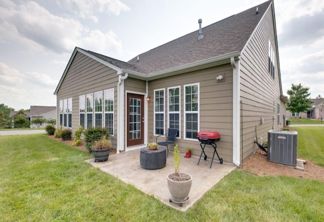 309 Patriotic Way, Mount Juliet, TN 37122 - back of property with a yard, a patio area, and roof with shingles