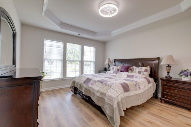 309 Patriotic Way, Mount Juliet, TN 37122 - bedroom with a raised ceiling, light wood-type flooring, and ornamental molding