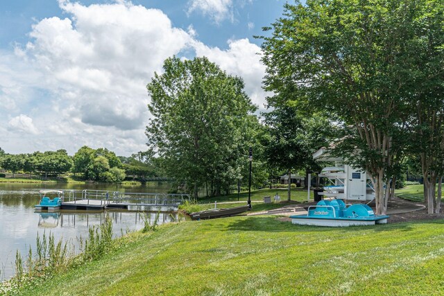 309 Patriotic Way, Mount Juliet, TN 37122 - view of green lawn featuring a floating dock, a water view, and view of scattered trees