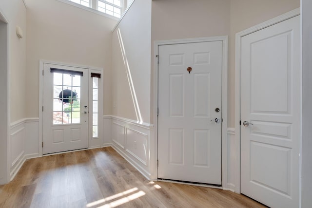 309 Patriotic Way, Mount Juliet, TN 37122 - foyer with light wood-style floors, wainscoting, and a decorative wall