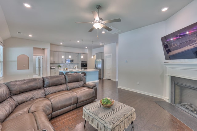 1655 Burrows Ave, Murfreesboro, TN 37129 - living room featuring ceiling fan, dark wood-type flooring, a glass covered fireplace, recessed lighting, and vaulted ceiling
