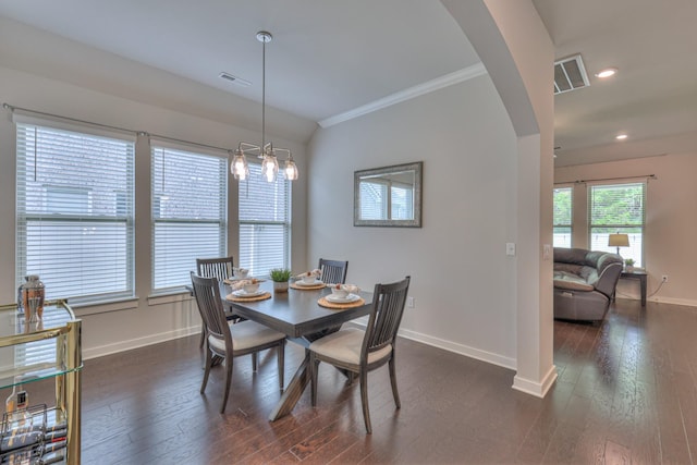 1655 Burrows Ave, Murfreesboro, TN 37129 - dining area with arched walkways, crown molding, dark wood-style floors, recessed lighting, and a chandelier