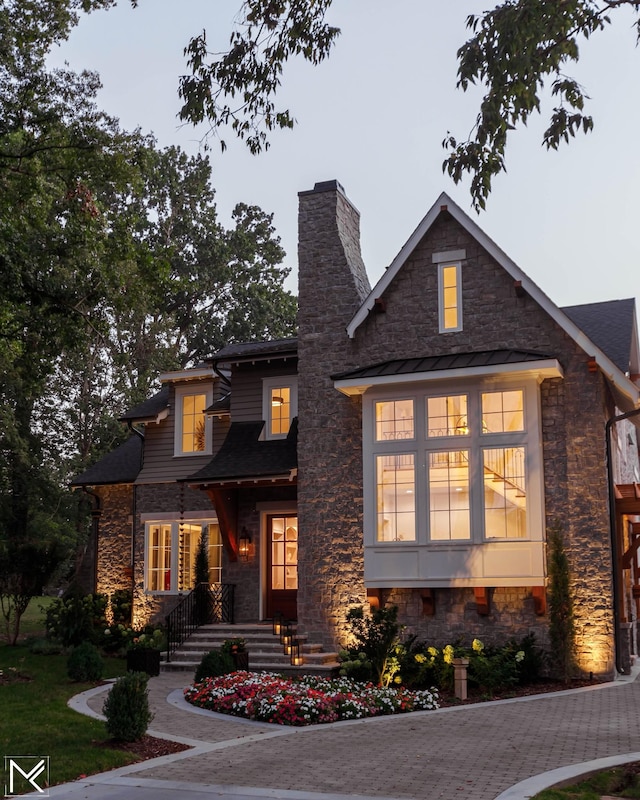 119 Winslow Rd, Franklin, TN 37064 - view of front of home featuring stone siding and a chimney