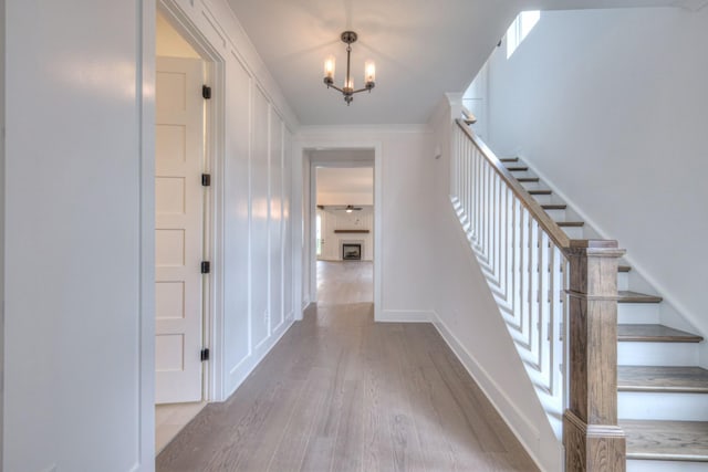 4013 Singing Creek Dr, Franklin, TN 37064 - staircase featuring wood finished floors and a chandelier