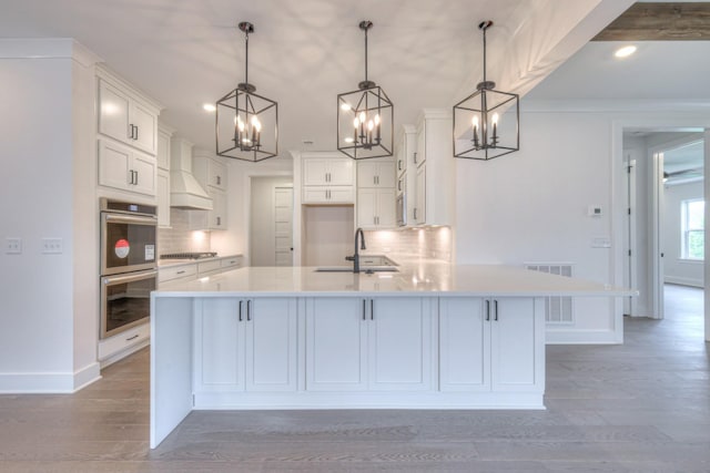 4013 Singing Creek Dr, Franklin, TN 37064 - kitchen with stainless steel double oven, a chandelier, tasteful backsplash, white cabinets, and recessed lighting