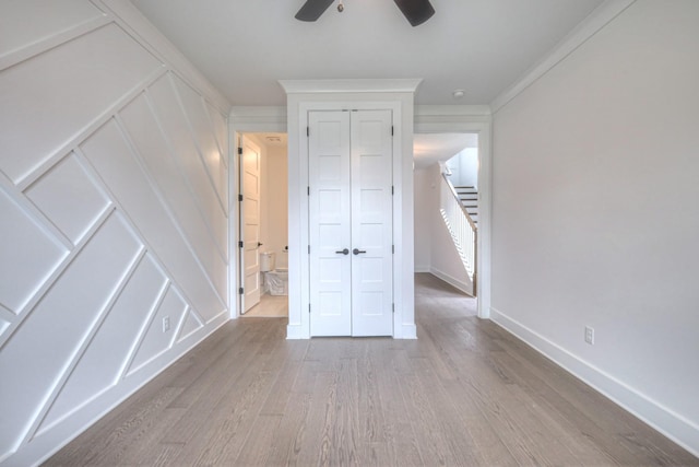 4013 Singing Creek Dr, Franklin, TN 37064 - unfurnished bedroom featuring wood finished floors, a ceiling fan, and a decorative wall