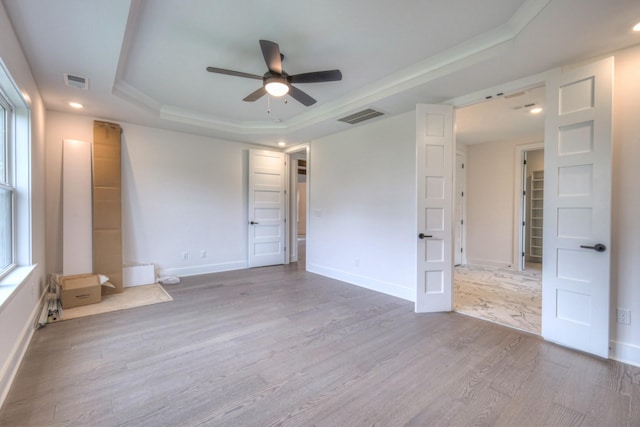 4013 Singing Creek Dr, Franklin, TN 37064 - unfurnished bedroom featuring a tray ceiling, wood finished floors, recessed lighting, and ceiling fan