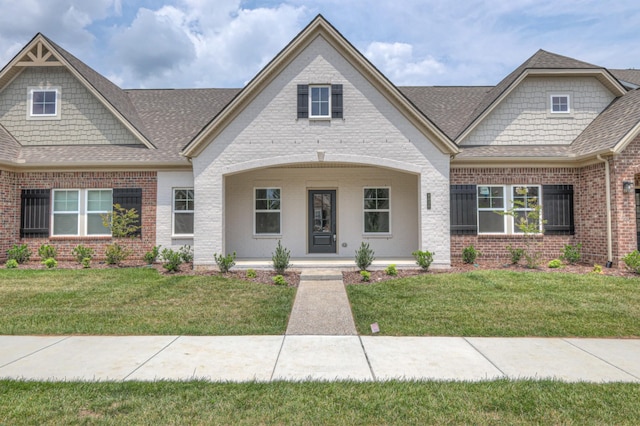 9024 Headwaters Dr Unit 168, Franklin, TN 37064 - view of front of property with brick siding, roof with shingles, a porch, and a front lawn