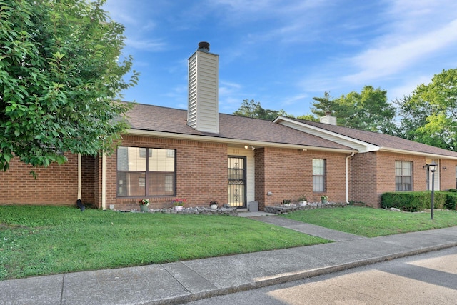 259 Mayflower Ln N, Madison, TN 37115 - ranch-style house featuring a chimney, brick siding, and a front yard